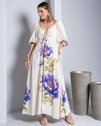 Vestido Florá Ayla da Areia Crôa com estampas florais, tecido leve, ideal para ocasiões casuais e eventos de verão.