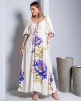 Vestido Florá Ayla da Areia Crôa com estampas florais, tecido leve, ideal para ocasiões casuais e eventos de verão.