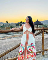 Vestido Tropicana da Areia Crôa, com estampa colorida e tecido leve, exibido em close na imagem.